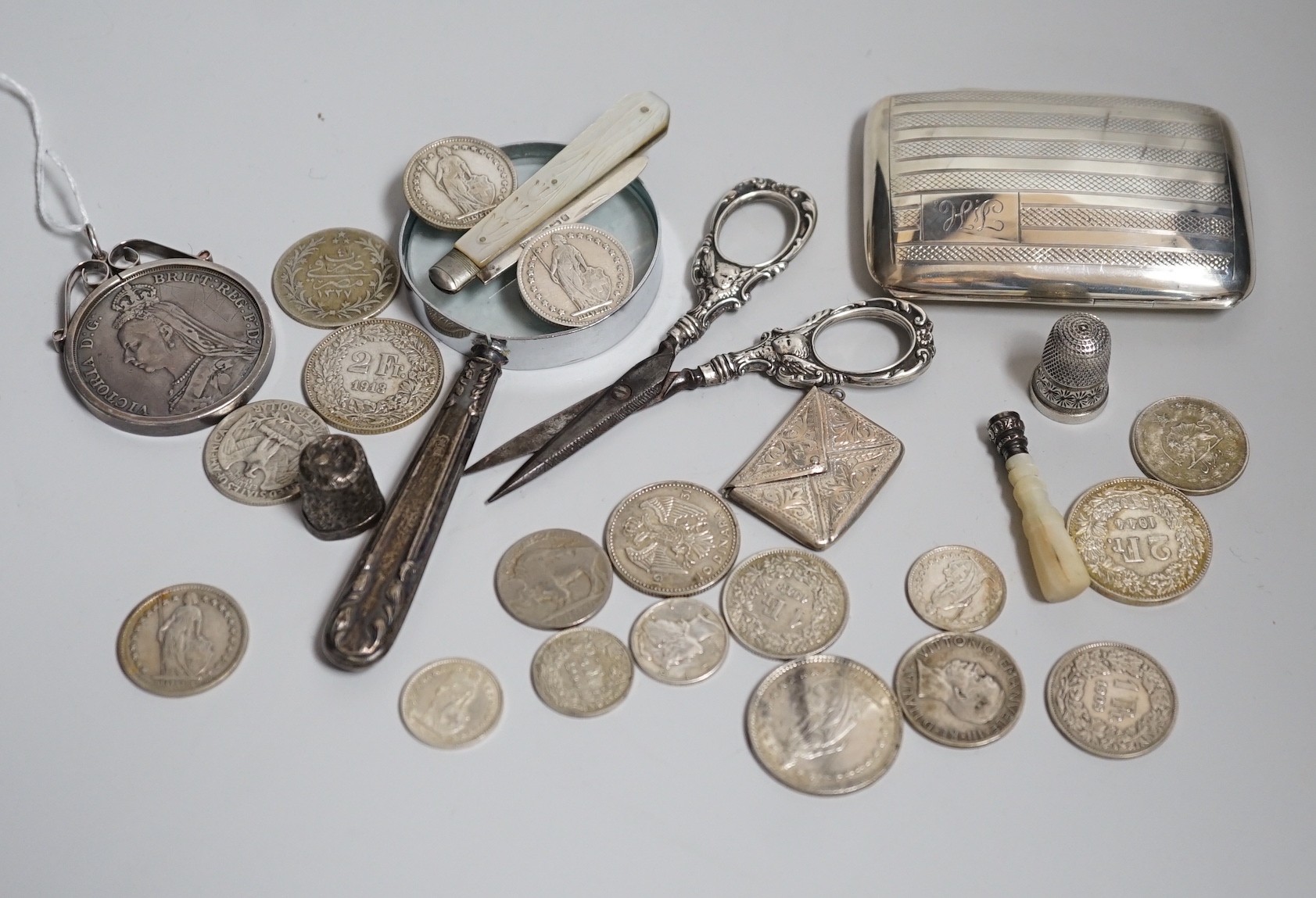 Miscellaneous small silver and white metal items including thimbles, a cigarette case, envelope stamp case, fruit knife, seal, etc and a group of assorted coinage including a silver crown in pendant mount.